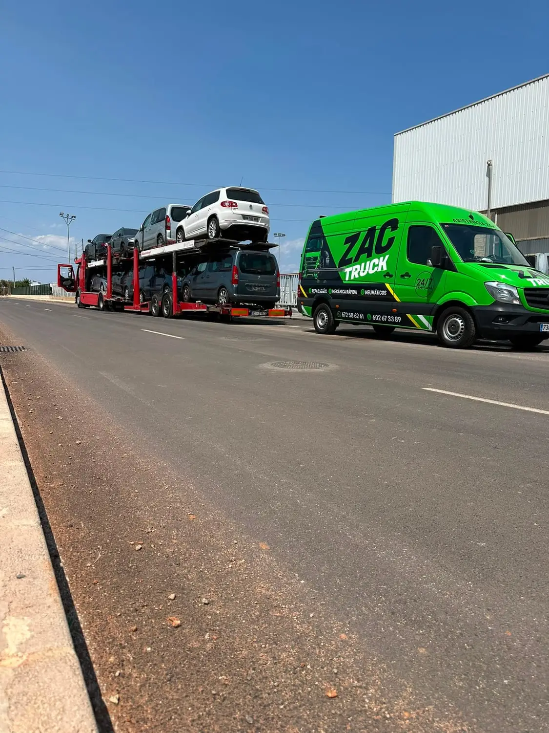 ZAC TRUCK van beside a loaded car transporter
