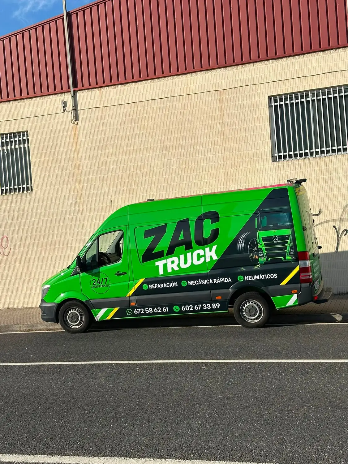 ZAC TRUCK van parked beside an industrial unit